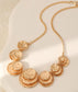 LAYERED CIRCLES STATEMENT NECKLACE