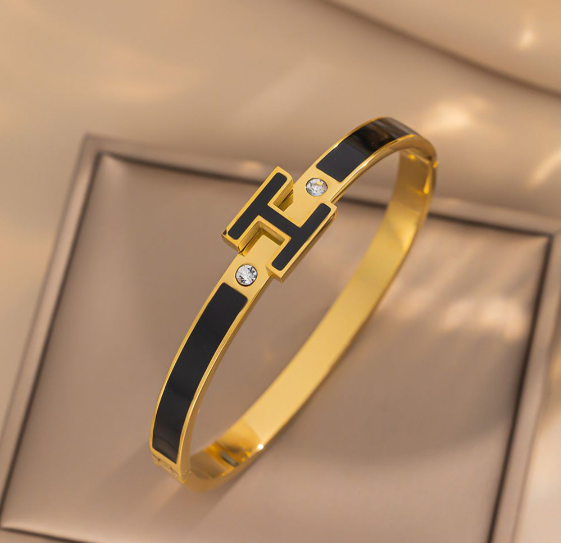 BLACK ‘H’ DETAIL BANGLE - GOLD