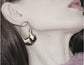 DNSK STATEMENT EARRINGS