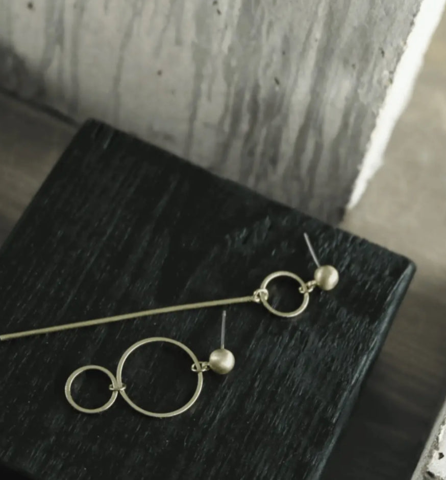 DNSK ASYMMETRIC EARRINGS